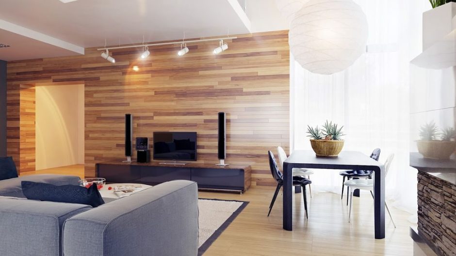 Natura w salonie Laminat imitujący drewno na ścianie: nowoczesny salon z elementami natury.