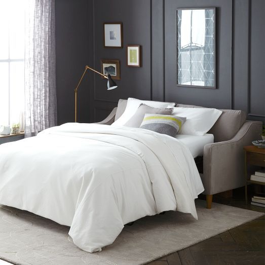 Sofa rozkładana Rozkładana sofa do spania w małym mieszkaniu w stylu minimalistycznym 2026.