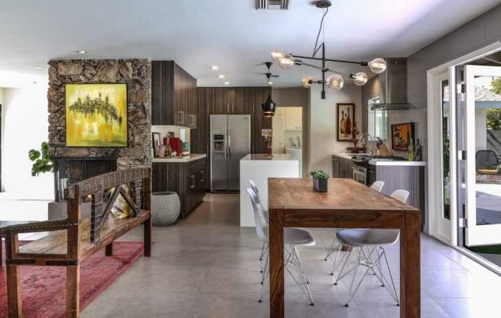 Jadalnia i kuchnia Jadalnia z kuchnią w stylu polinezyjskim: Naturalne materiały i otwarta przestrzeń.