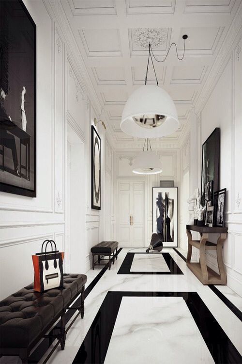 Nowoczesny przedpokój 2026 Inspirująca aranżacja przedpokoju 2026: nowoczesny design z elementami dekoracyjnymi i szafą.