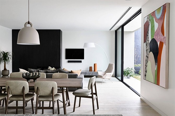 Salon z Jadalnią Elegancka przestrzeń salonu i jadalni w nowoczesnej rezydencji 2026: minimalizm i kontrastowe kolory.