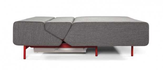 Sofa Szara: Elegancja i Komfort Wygodna sofa Pil-low w szarym kolorze, pasująca do wnętrz z metalowymi wykończeniami.